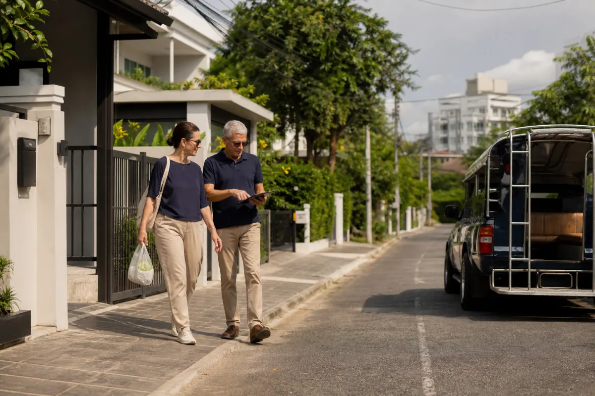 Mature couple testing errands and local transport from a Chiang Mai residential area